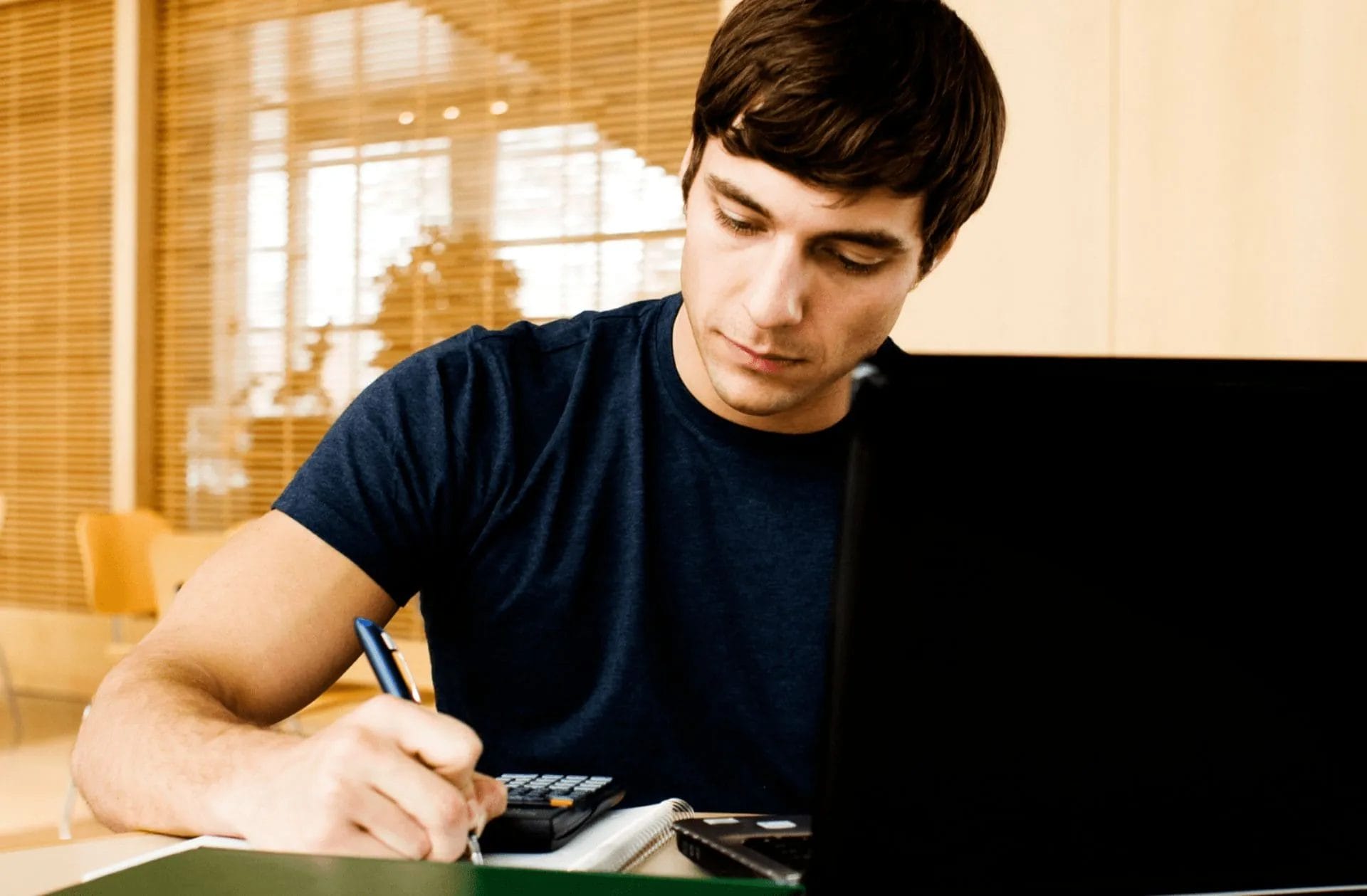 Someone studying at a laptop