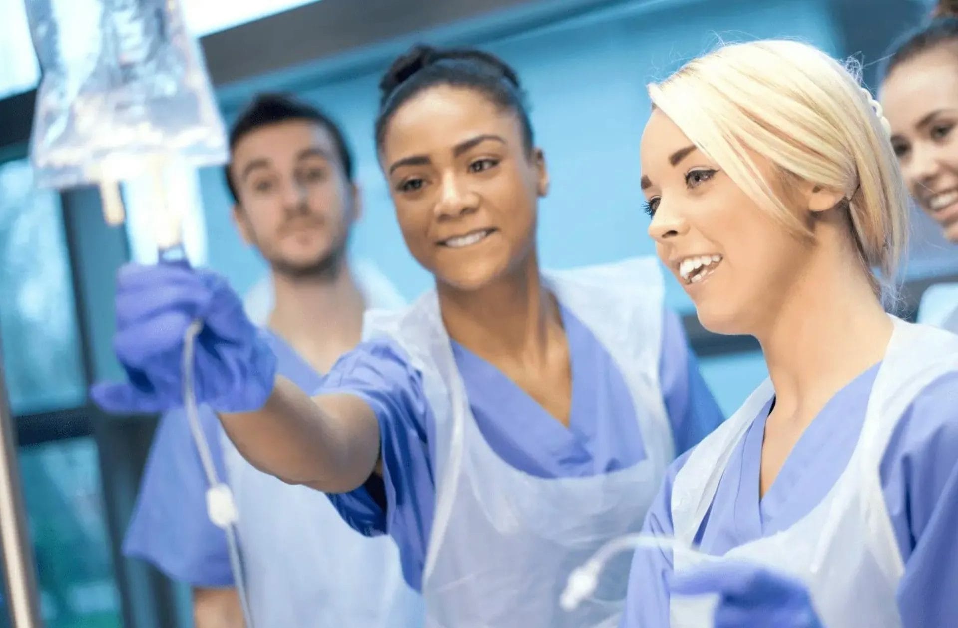 Nurses using an IV drip