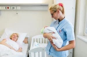 A midwife with a baby