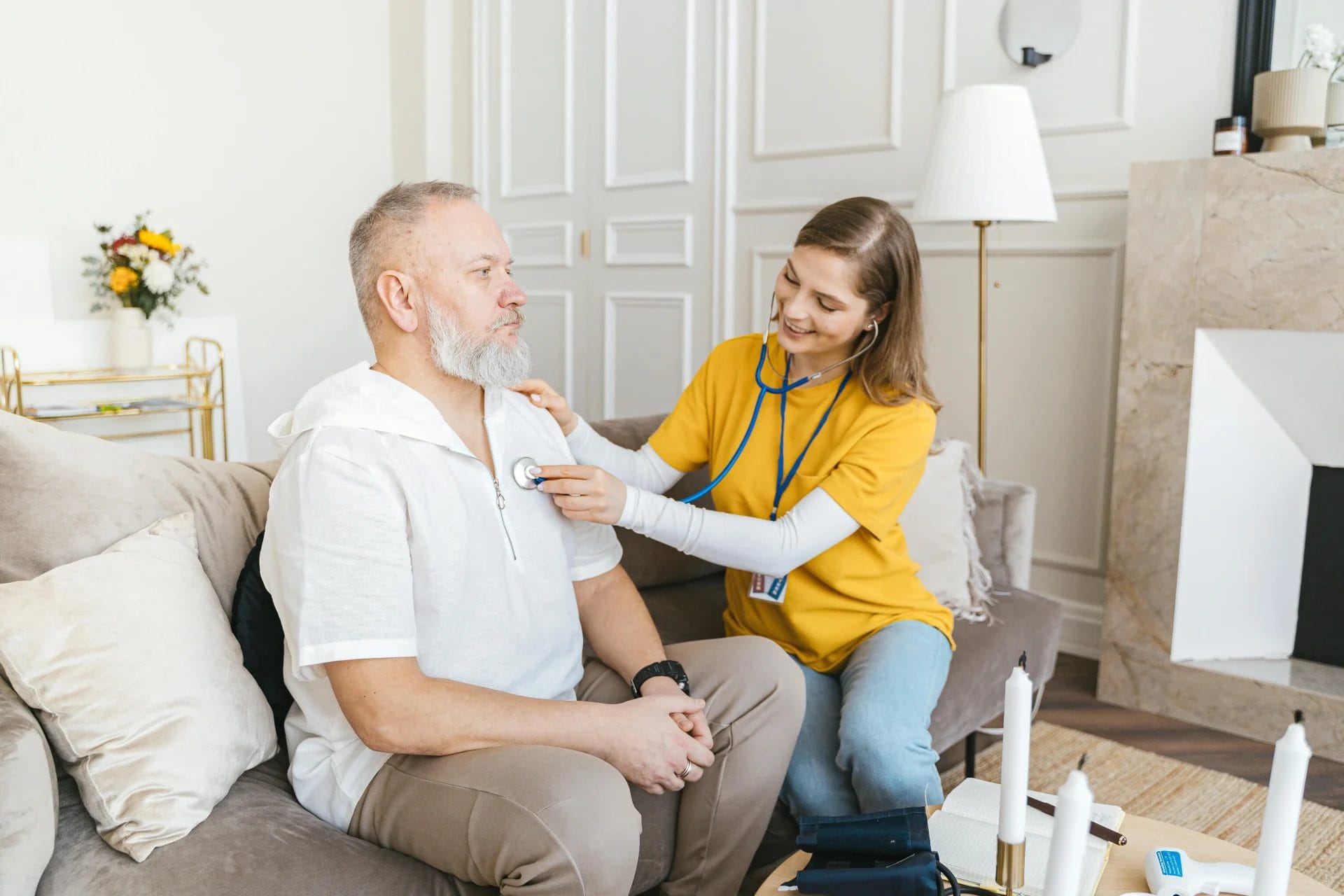 A district nurse helping a patient