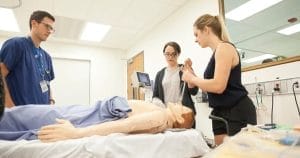A doctor training two women